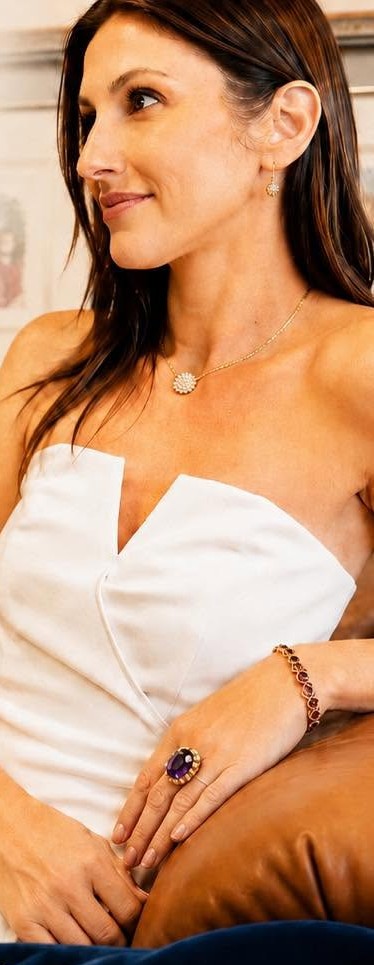 Model wearing an antique amethyst ring, garnet bracelet and diamond pendant from the estate collection